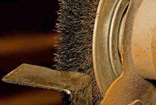 a bench grinder set up for wire brush work