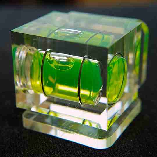 A tubeular spirit level set into a solid block of resin/plastic