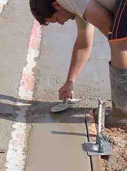 Smoothing the smaller areas with a steel float and edger