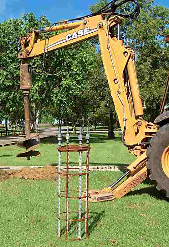 an auger attachment on a backhoe.