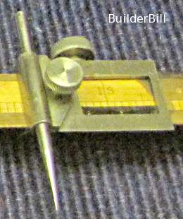 A close up of a beam compass