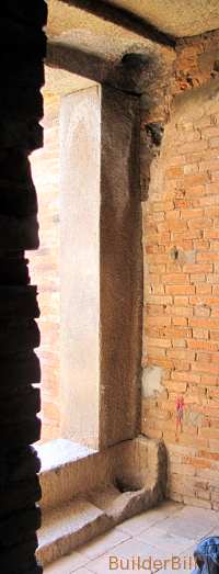 Old pivot holes are all that is left of a temple door