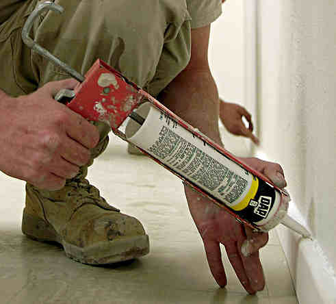 Using a caulking gun