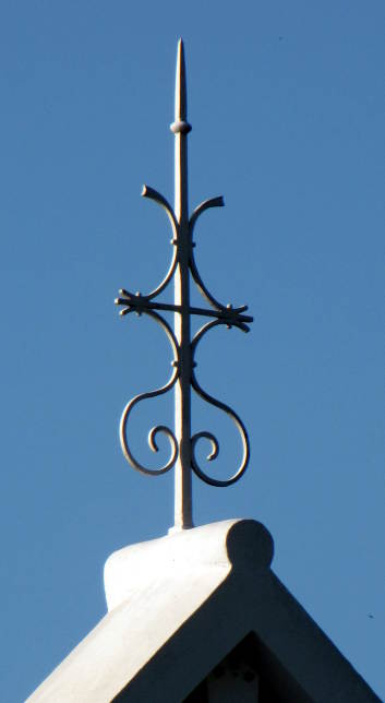 a finial on the apex of a gable roof