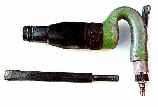 A large hammer with a chisel point
