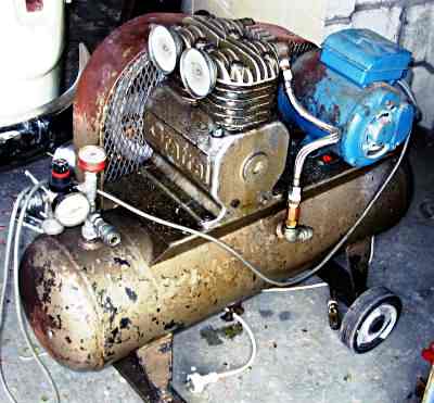 A twin cylinder portable air compressor